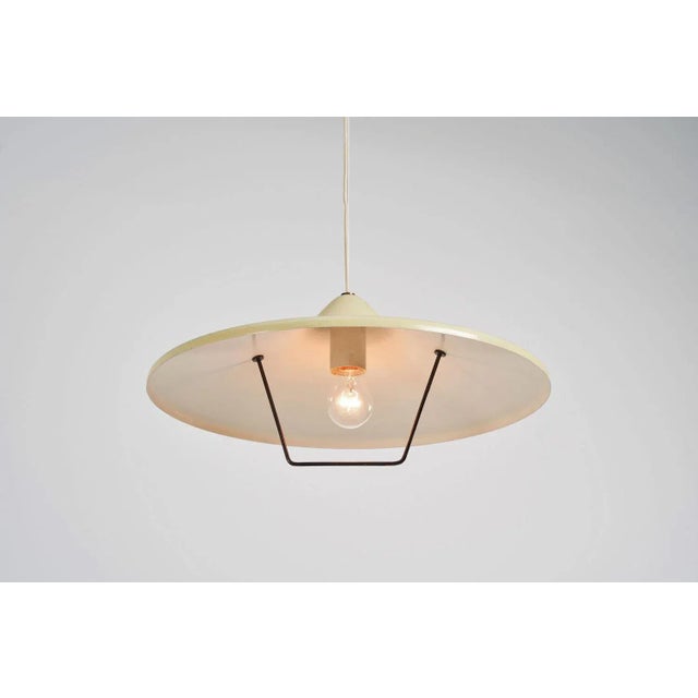 Rare counterbalance pulley pendant lamp designed and manufactured by Stilnovo, Italy 1955. This pendant lamp has the...