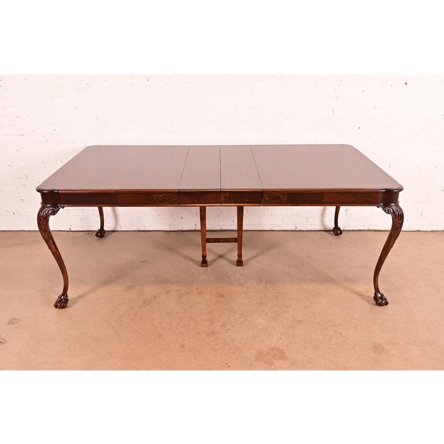 An exceptional Chippendale or Georgian style extension dining table In the manner of Romweber USA, 1940 Gorgeous mahogany,...