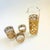 A 5 piece mid century cocktail set by Culver. Each piece is wrapped in a 22 kt gold clover pattern. The set includes 1...