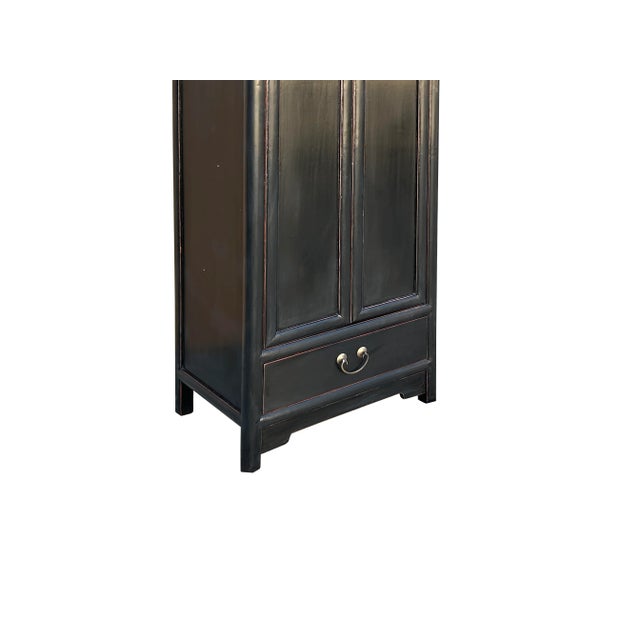 Unveil the elegance of the Orient with this exquisite, slim-profile Chinese cabinet. Handcrafted with a timeless black...
