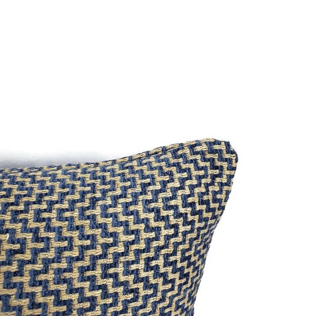From Schumacher is Orwell in the color Lapis pillow cover. This pillow features blue chenille threads and gray threads...
