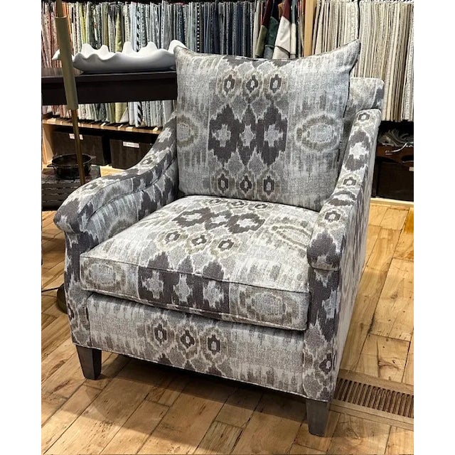 The Frankel chair from EJ Victor has a traditional style with a fabric that is a contemporary take on an ikat pattern. The...