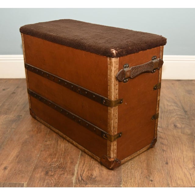 Decorative vintage leather trunk stool, designed in the traditional campaign and travelling-luggage style The rectangular...