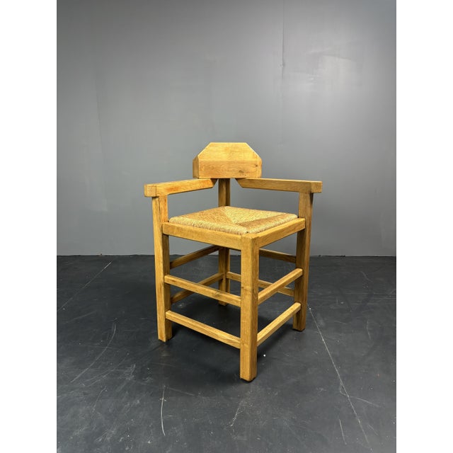 Dutch oak corner chair with rush seat, 1970s-1980s solid oak corner chair from the netherlands, 1970s-1980s. The design is...
