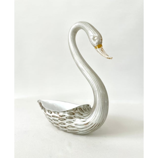 Single Murano glass bowl or dish in the shape of a swan. Thick clear glass overlaid on white glass with bullicante...
