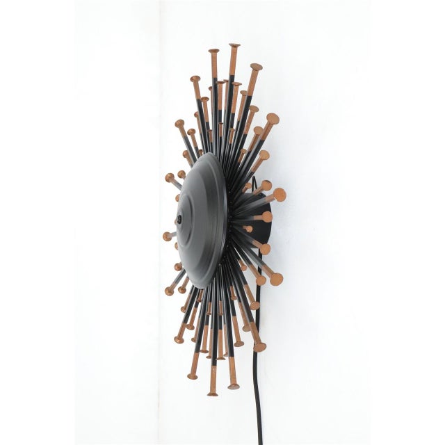 1960s, dantoft, denmark. Very rare sunburst wall lamp in an exceptionally large size. Handcrafted steel construction....