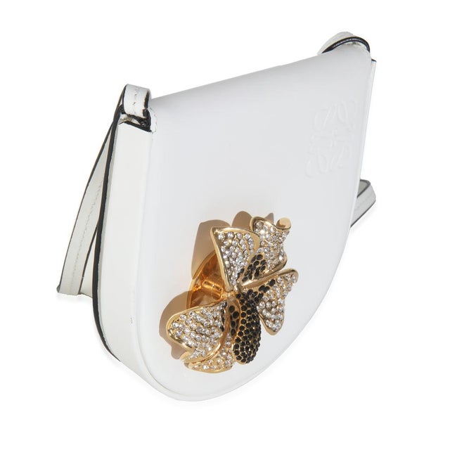 Item #: T145616 Features Interior: Three Card Slots. One Slip Pocket. Dimensions: 4.9 x 4.5 x 1 in Handbag Closure Type:...