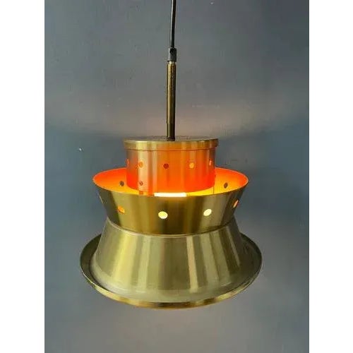 Very rare Doria Leuchten spage age pendant lamp. This lamp originally has an oval glass shape surrounding the metal part,...