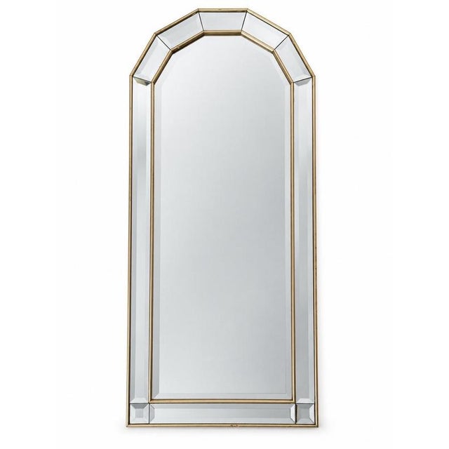 The mirror is distinguished by its exceptionally slender proportions and architectural, softly arched silhouette. Wide...