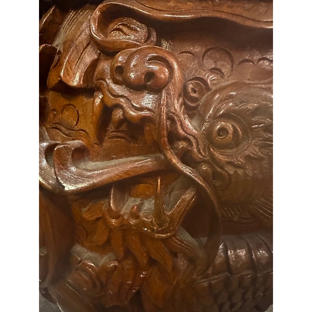 Pair of impressively carved solid wood end tables having the shape of garden stools, with dolphins, birds, flora and...