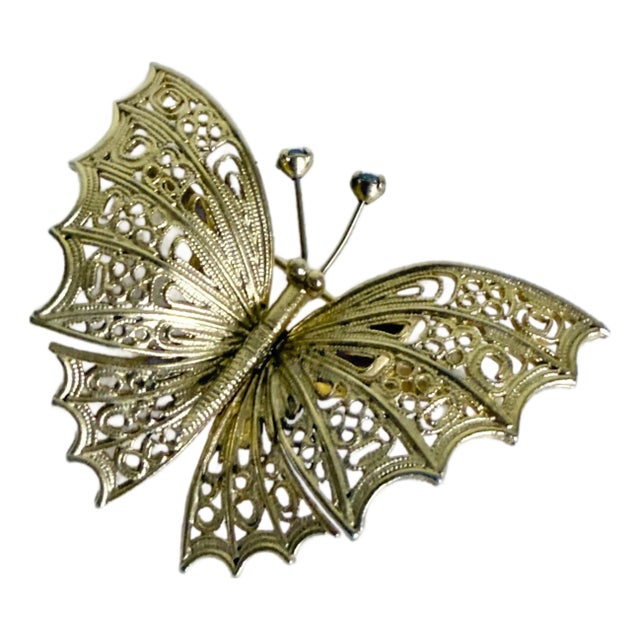 Vintage 1960s Art Nouveau Revival Gold Tone Filigree Butterfly Brooch With Blue Rhinestone Accents For Sale