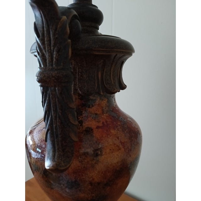 Warm, rich, and beautifully detailed, this Tuscan‑style table lamp brings classic Old World charm to any space. The body...