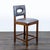 Wood stool with cut-out back. Brand: Palecek. Dimensions (in): 18W x 19D x 37H.
