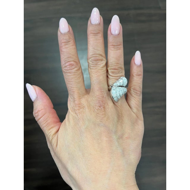 This exquisite ring boasts 89 dazzling baguette-cut diamonds with a total carat weight of 2.23. Crafted from high-quality...