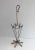 This unusual umbrella stand is made of gold gilt iron. This represents an umbrella made of gild gilt iron. This is a...