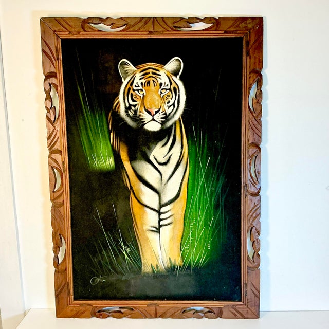 What a stunning oil on velvet painting. The original painting is signed and features a Bengal Tiger standing among Kelly...