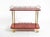 Beautiful 1960s Aldo Tura serving, bar cart made of wood, covered in red goatskin and finished with a thick clear lacquer...
