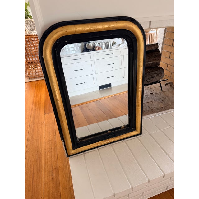 All original 19th century small French Louis Philippe Gold Gilt Ebonized mirror. Has original glass but has chips.