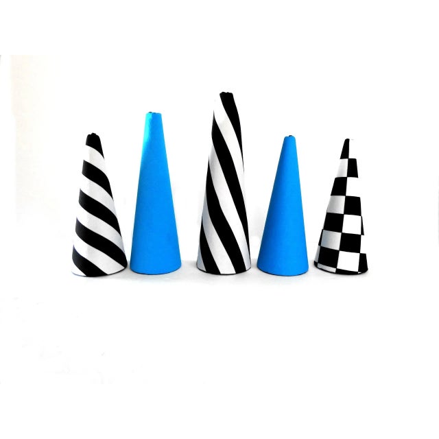 Minimalist conical Christmas trees set in Memphis style. Black and white checkered, striped, solid cyan. Great space saver...