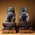 This striking pair of guardian lion figures (often referred to as Foo Dogs) is masterfully crafted from a bronze body and...