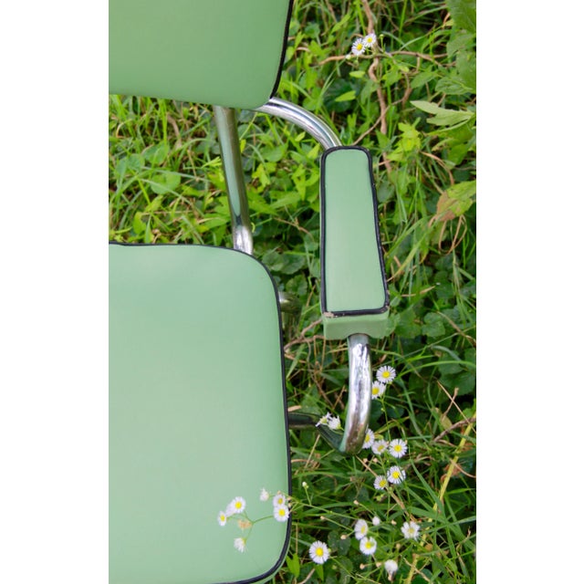 This minty mid-century chair was realized in Italy during the glorious 50s. It features a solid chromed structure and...