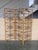 This Mid-Century-Modern eye-catching rattan or wicker and bamboo three-panel room divider with filigree decoration was...
