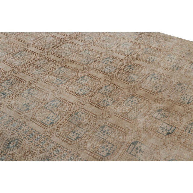 Hand-knotted wool and originating from Turkey circa 1950-1960, this 8x13 vintage Ersari rug is from the same provenance, a...