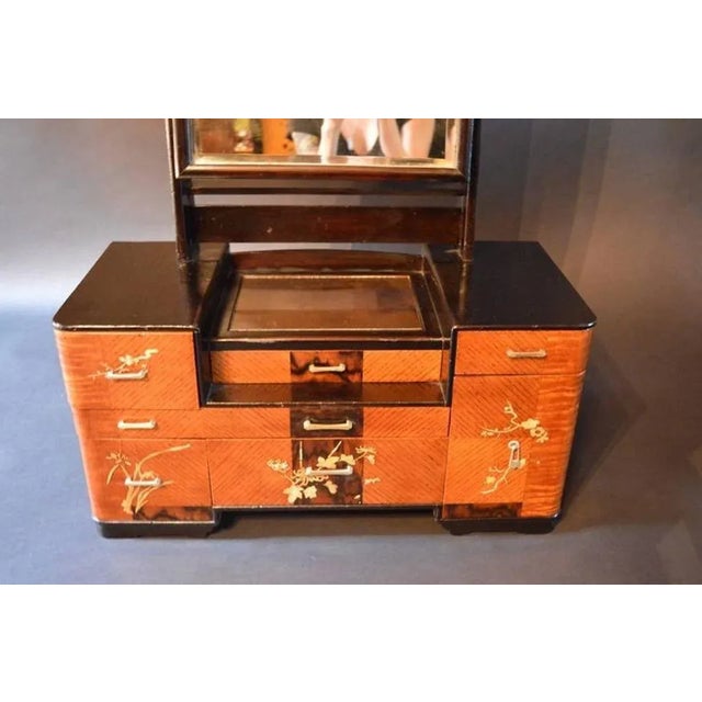Chinese deco vanity. Top above drawers is mirrored. Mother-of-pearl details.