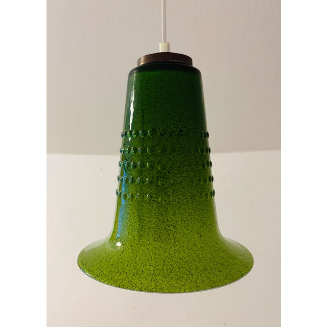 A beautiful pendant lamp in green glass with a simple and timeless design. This Swedish lamp is attributed to Gert Nyström...