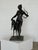 This bronze figure depicts Diana the Huntress standing beside a greyhound, cast in the late 20th century. She is modelled...