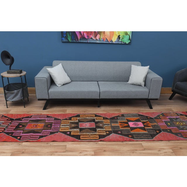Vintage Hand-Knotted runner rug is a semi-antique vintage area rug. The '70s Eastern region of Anatolia's unique rug is...
