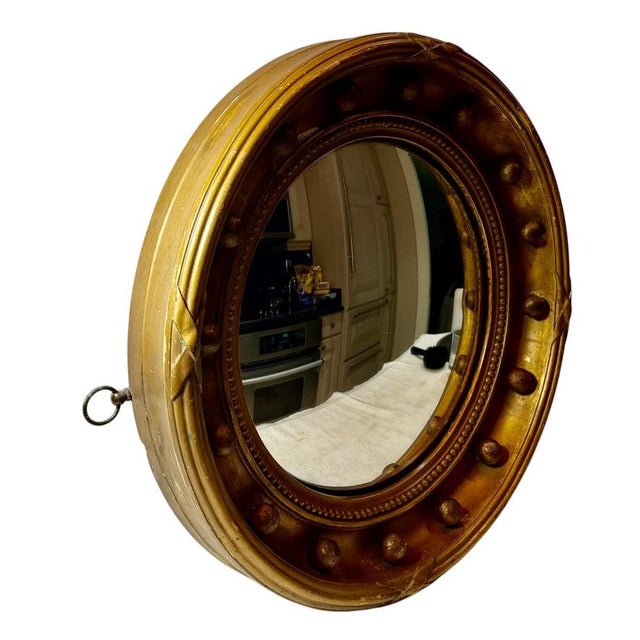 Fine English Regency period round convex mirror retaining its original glass, frame, and construction. This authentic...