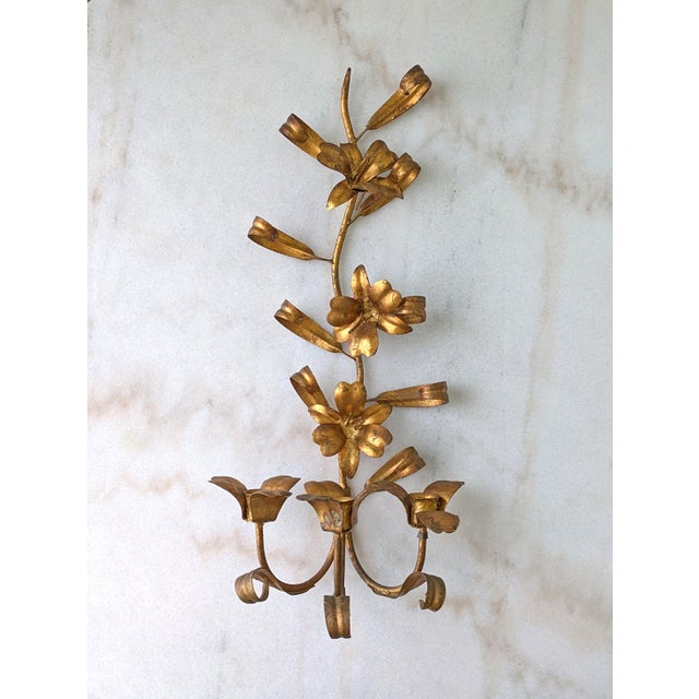 An authentic Mid Century Italian tole candle sconce with floral motif and three candle holders, made in Italy.