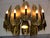 Striking Mid-Century Modern Brutalist chandelier designed by celebrated metal sculptor Tom Greene for the Feldman Lighting...