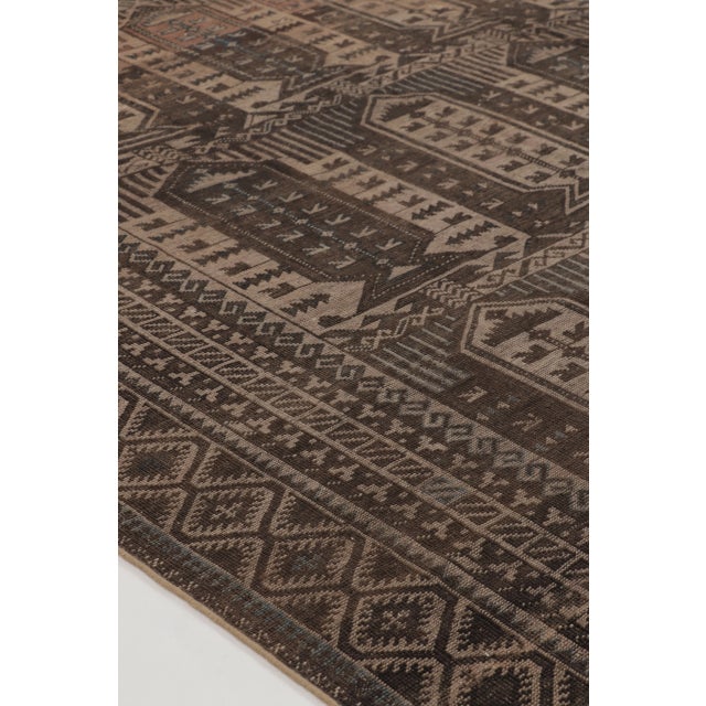This vintage 7x12 Turkish rug is a sophisticated hand-knotted wool weaving dating to circa 1950–1960. The piece features...