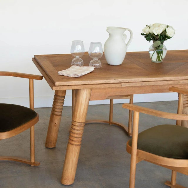 Incredible extendable wood dining table by Charles Dudouyt from France, 1940s. Stunning rectangular oak wood top with...