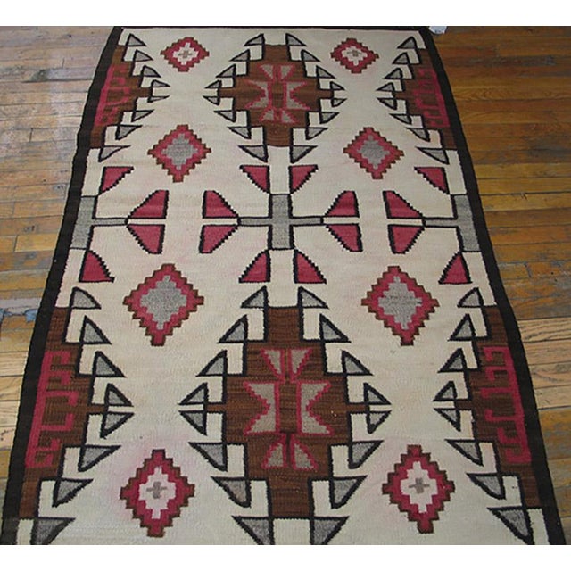 Antique Geometric Medallion Flat Weave Rug, Circa Date: 1930s. This striking flat weave piece exemplifies the enduring...