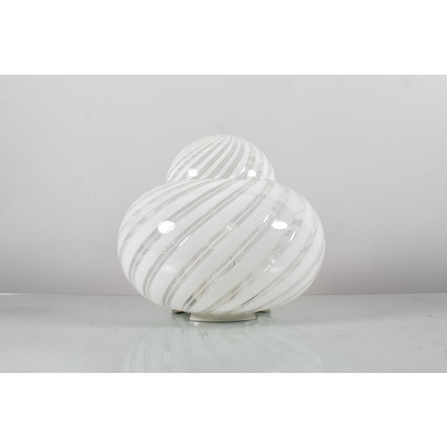 Set of two murano glass table lamps with double milky spiral and metal. Italian production from the 70s by f. Fabbian. A...
