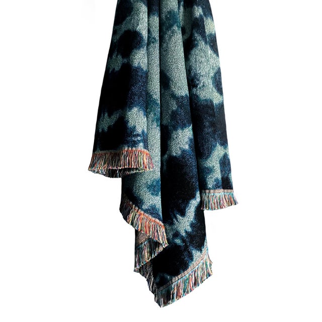 Jade green and indigo blue jacquard woven throw with fringed edges. Woven with recycled cotton on a jacquard loom, made in...