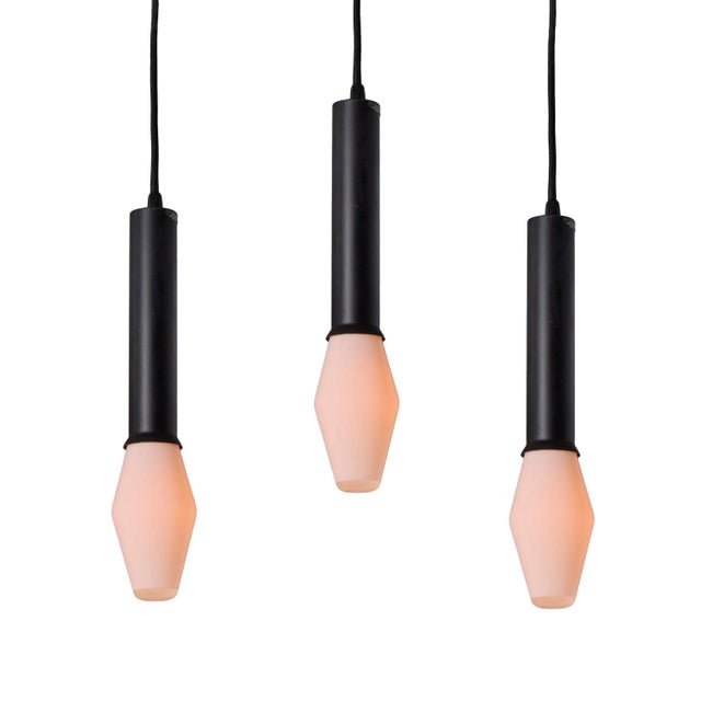 Set of Three Tapio Wirkkala Black Metal and Glass Pendants with original Airam bulbs Executed in black painted metal and...