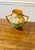 This vase exemplifies American art pottery known for its decorative qualities and floral theme. This vase has a classic...