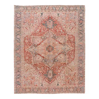 Antique Persian Heriz Wool Rug Handmade in Red Featuring a Medallion Motif For Sale