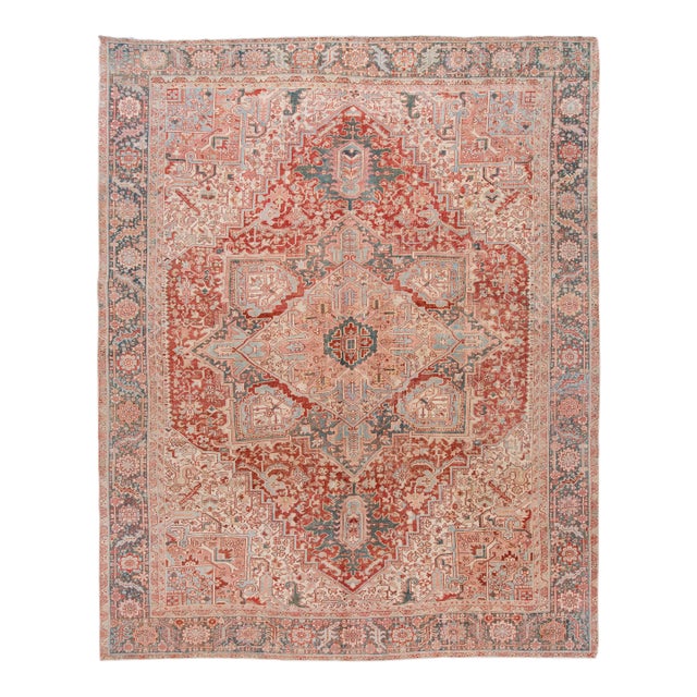Antique Persian Heriz Wool Rug Handmade in Red Featuring a Medallion Motif For Sale