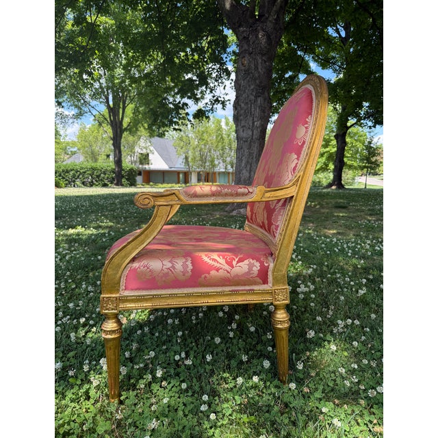 Gilded Louis XVI-Style Armchair PRICE $375 Attractive gilded armchair upholstered in red floral damask fabric on its...