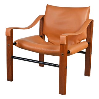 1960’s MCM Chelsea Safari Chair by Maurice Burke for Arkana Furniture Cognac Faux Leather Teak & Metal For Sale