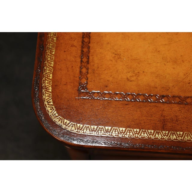 This is a superbly crafted leather wrapped and gold tooled embossed Maitland Smith chest of drawers. The piece is finish...