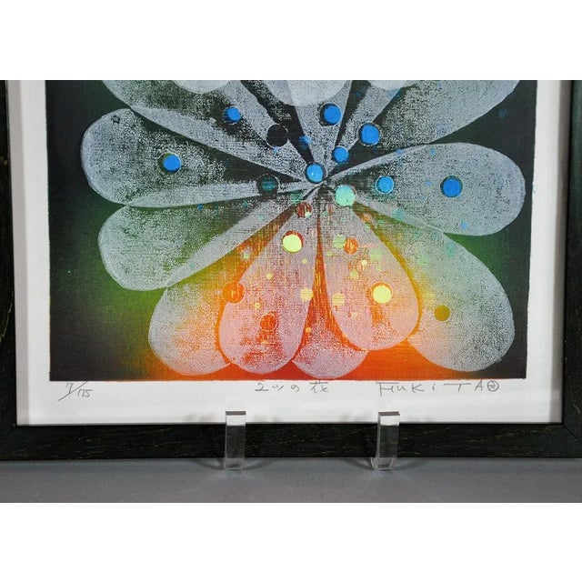 Piece is signed Fukita and is 7/75 woodblock. There are Japanese characters in the center that name the piece. It is...