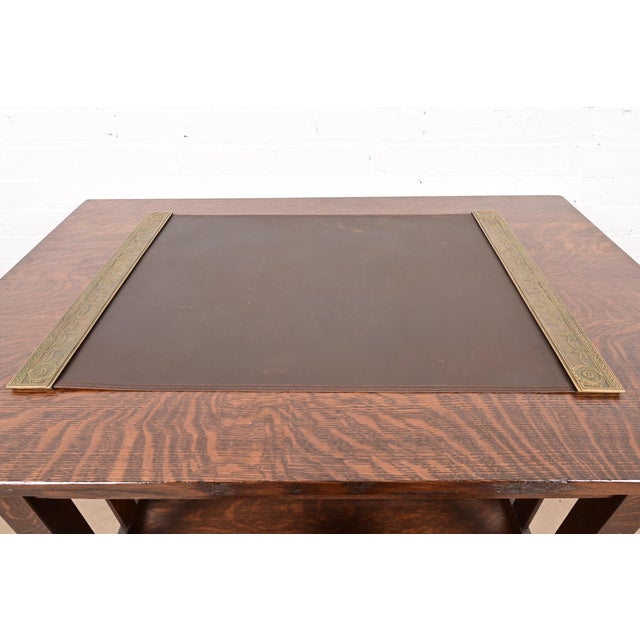 A gorgeous pair of Art Deco or Arts & Crafts period gilt bronze blotter ends in the "Adam" pattern, with a custom brown...