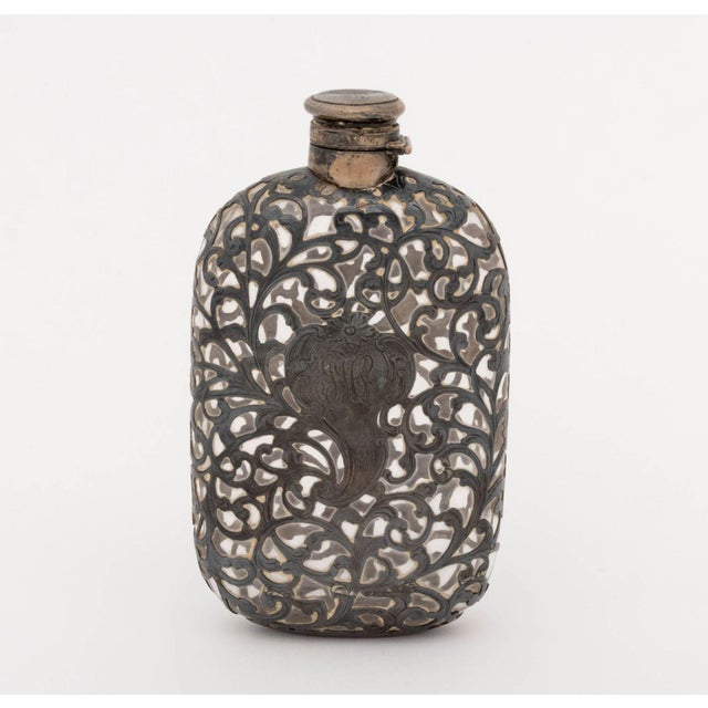 Collection of Three American Art Nouveau Silver and Cut Crystal Flasks, comprising: a Gorham pure silver overlaid glass...