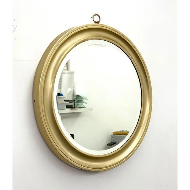 Rare and magnificent modernist mirror in gilded aluminum. The item was produced in Italy during the 1960s. Amazing wall...